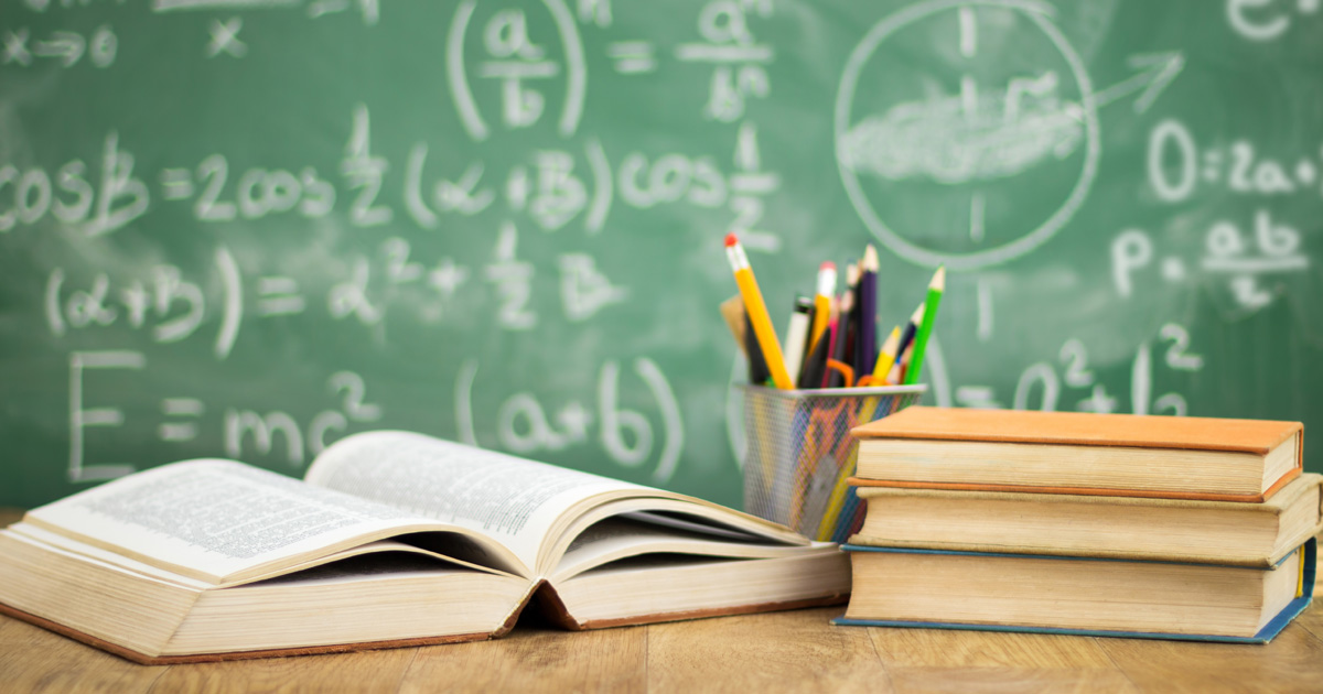School books on desk, education concept