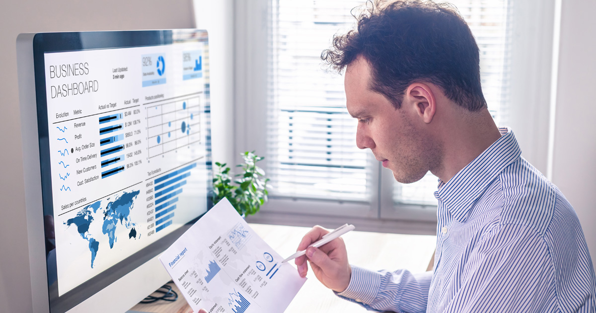 Businessman working with dashboard and metrics, graph and charts and financial report data