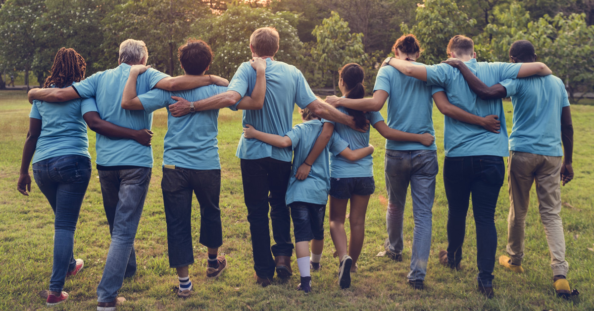 Group of diversity people volunteer arm around