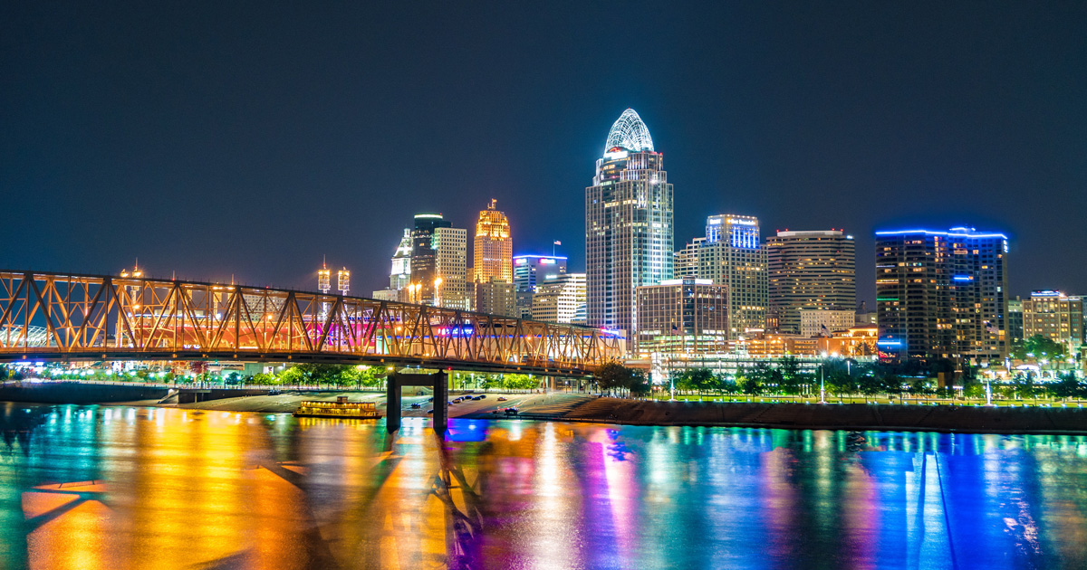 Photo of lighted buildings near river