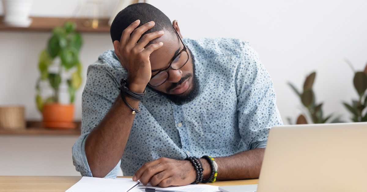Upset stressed office worker worried about problem at work