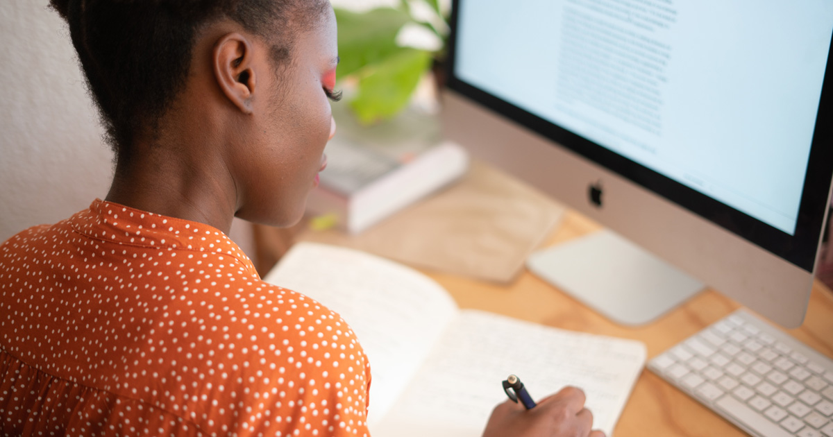 Woman writing on her notebook