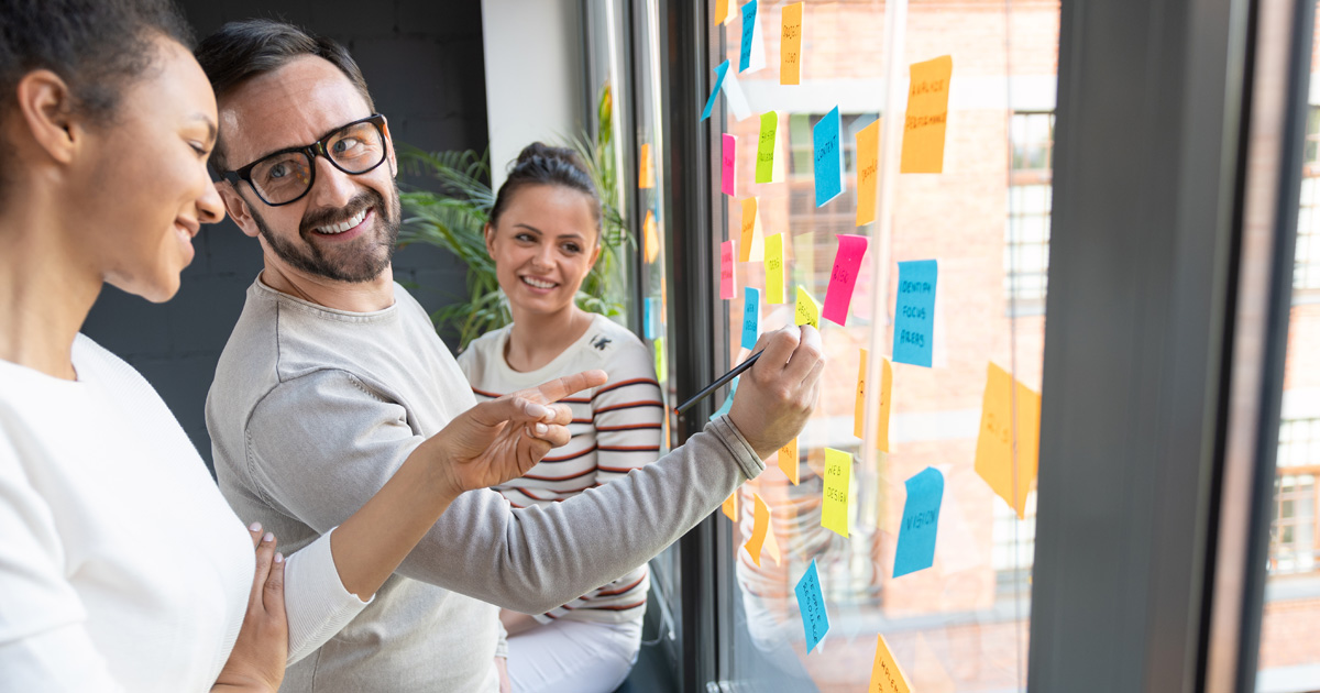 Business people meeting at office and use post it notes to share idea