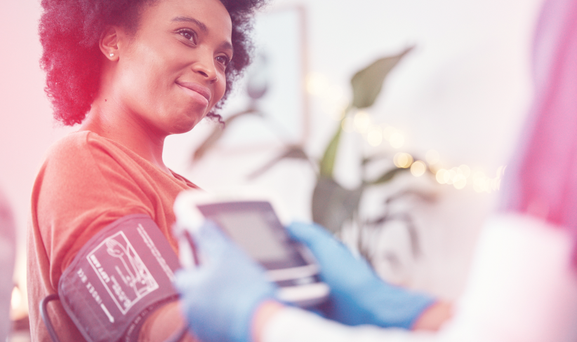 Woman getting her blood pressure taken