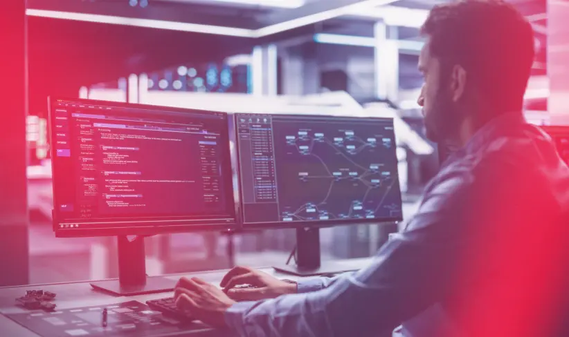 Man working as cloud services provider sitting at computer